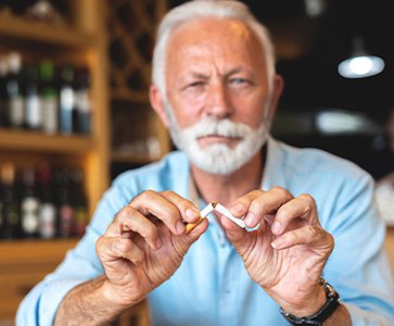 Quitting bad habits like smoking can help keep your dental implants from failing